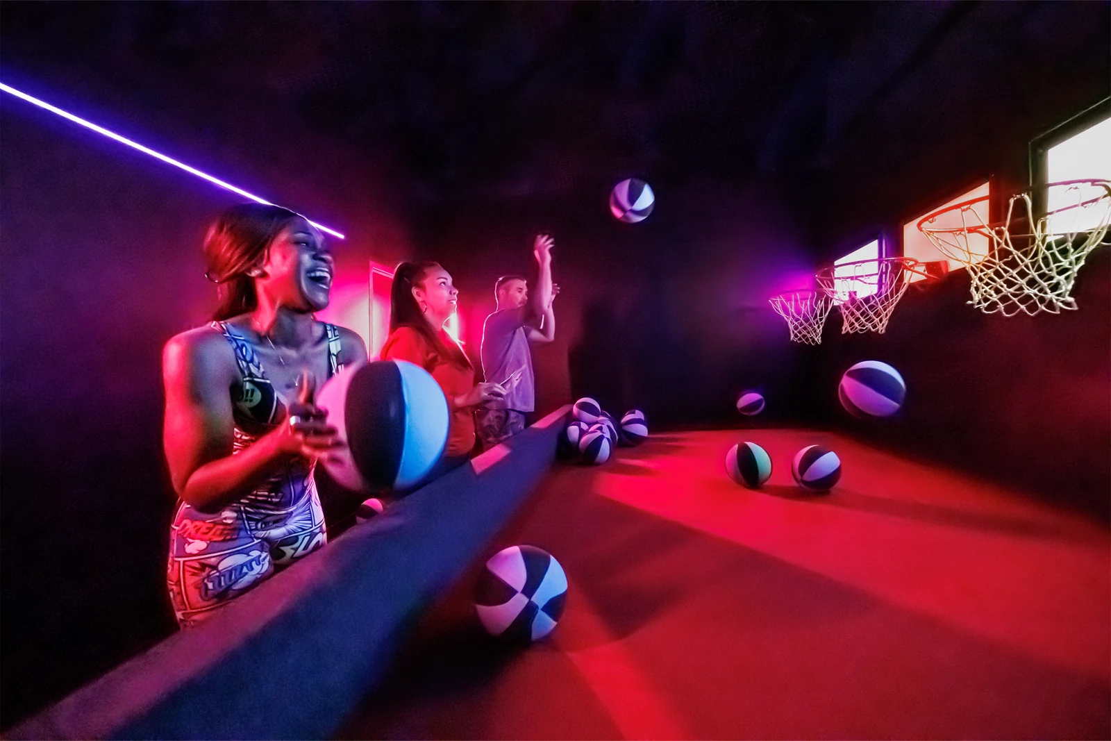Players shooting at illuminated basketball targets